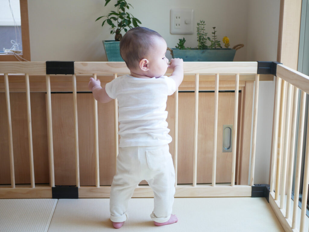 A,Baby,Holding,A,Playpen,Tries,To,Walk